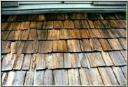 This After example demonstrates why you should hire a company that knows how to do the repairs properly.  The previous Roof Cleaner had the opportunity to fix the problem and opted to add to the dilemma by just sliding Metal Shims under the existing cedar shakes and not replacing those shakes correctly. Costing the homeowner plenty of money.